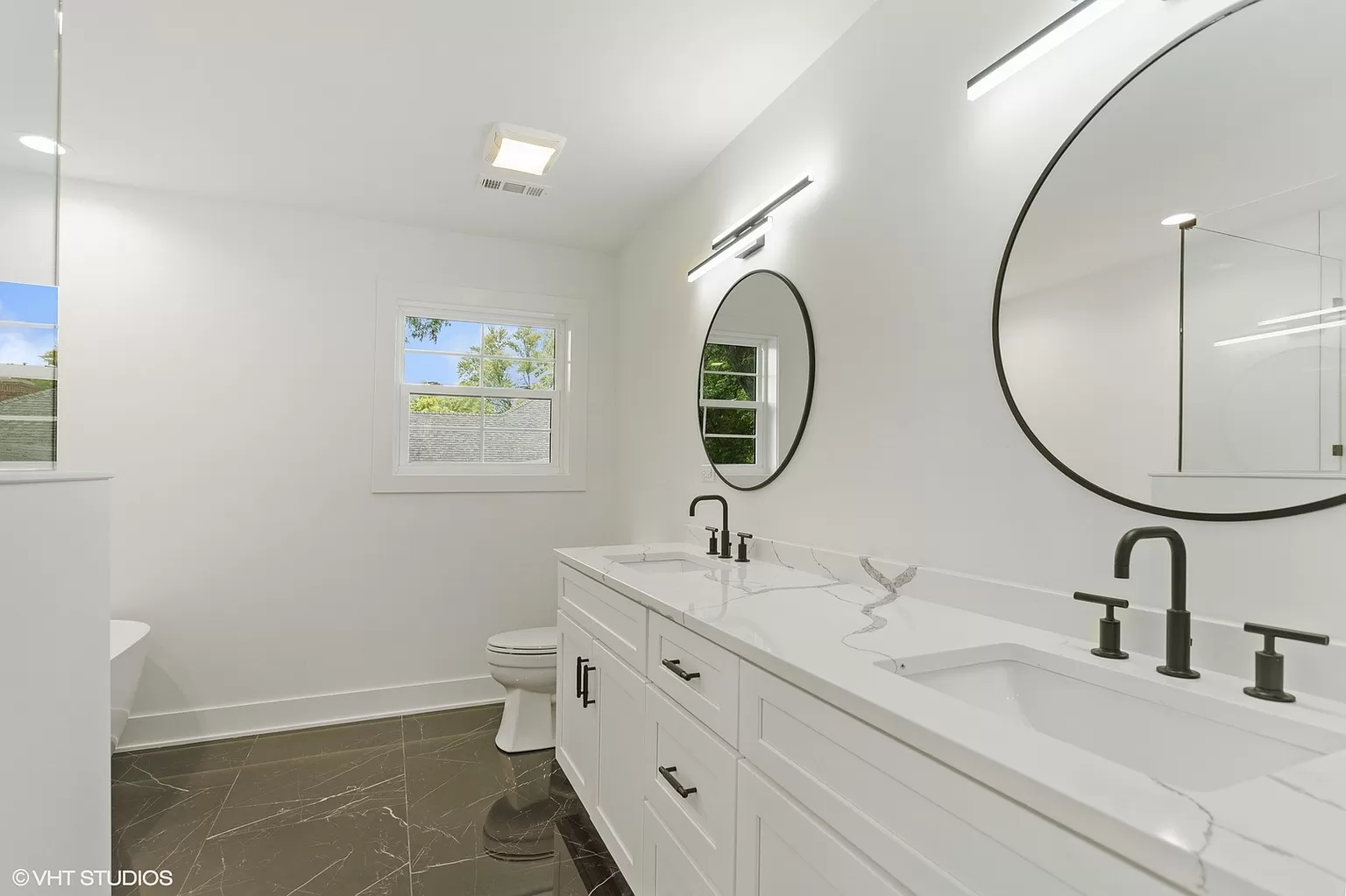 Bathroom renovation with tiled shower and refined fixtures