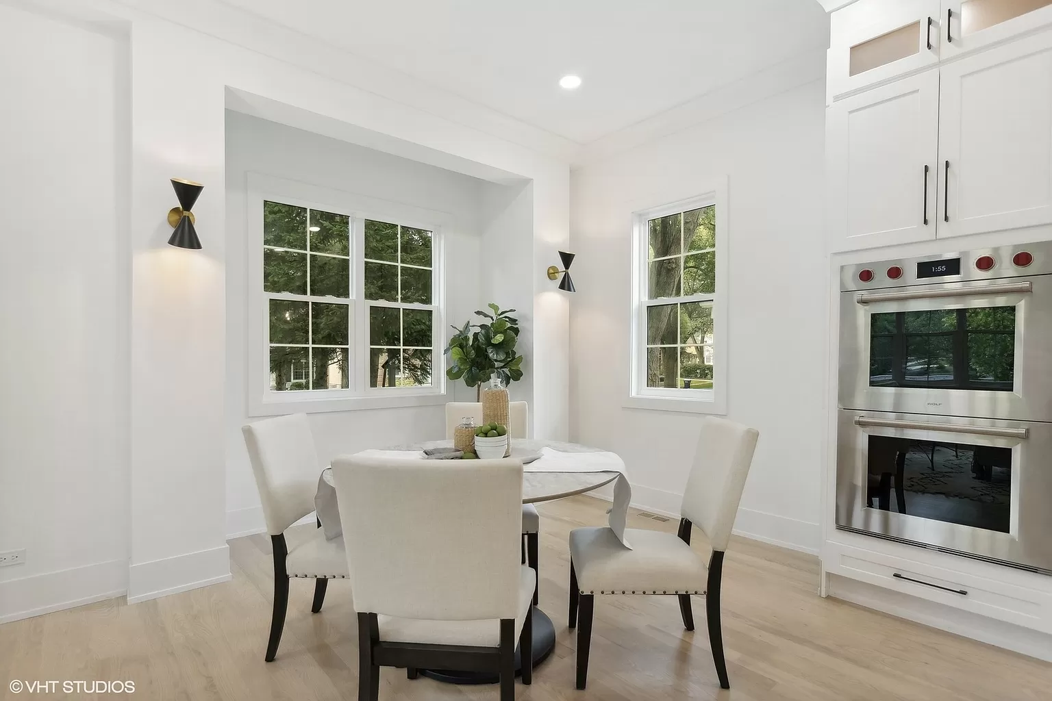Custom built-in coffee area with cabinetry and stone surfaces