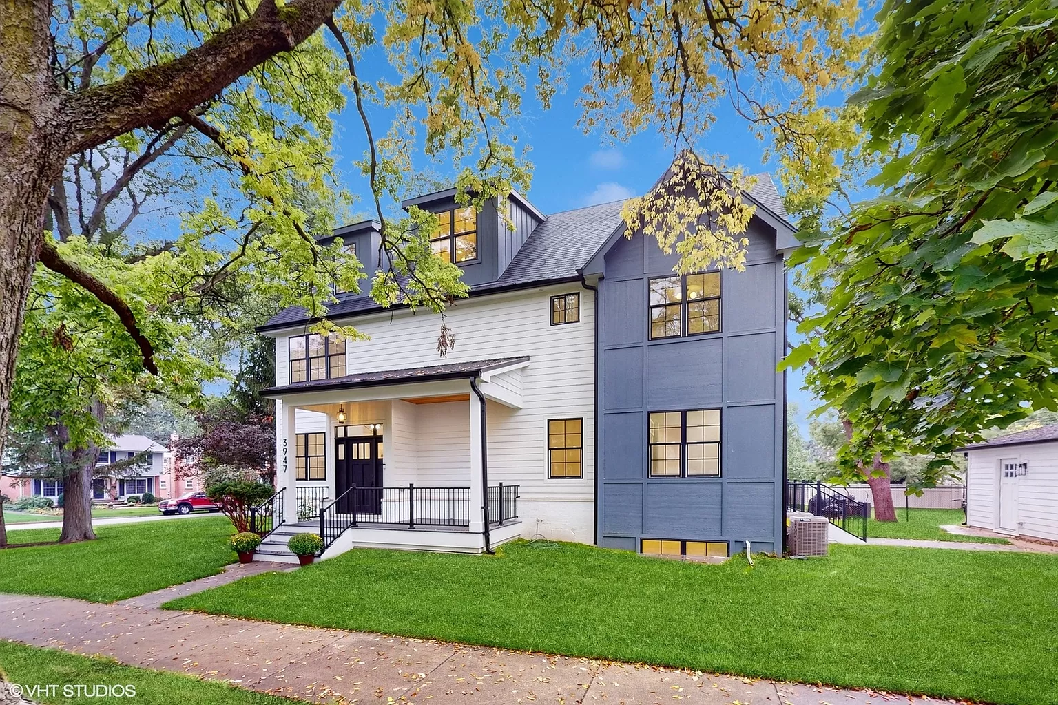 Front exterior of a remodeled home with updated facade and landscaping