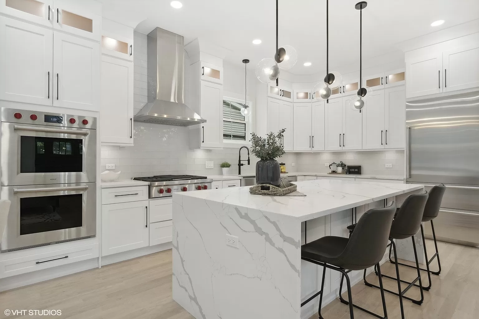 Kitchen with custom cabinetry, stone counters, and open shelving